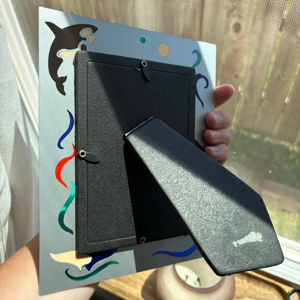Vintage metal frame with dolphin and orca colorful designs